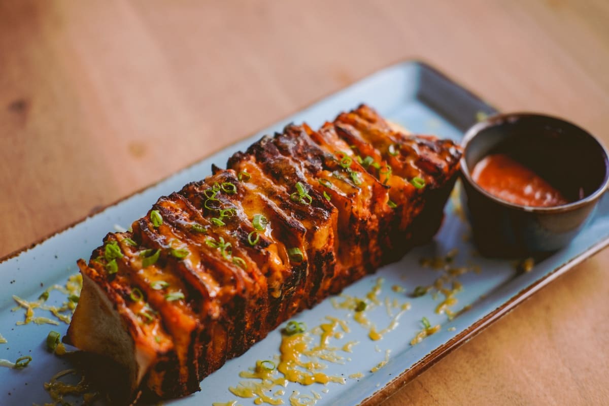 Peri-Peri Chicken Kebab — spiced mince layered in roti, glazed and char-grilled, with sauce